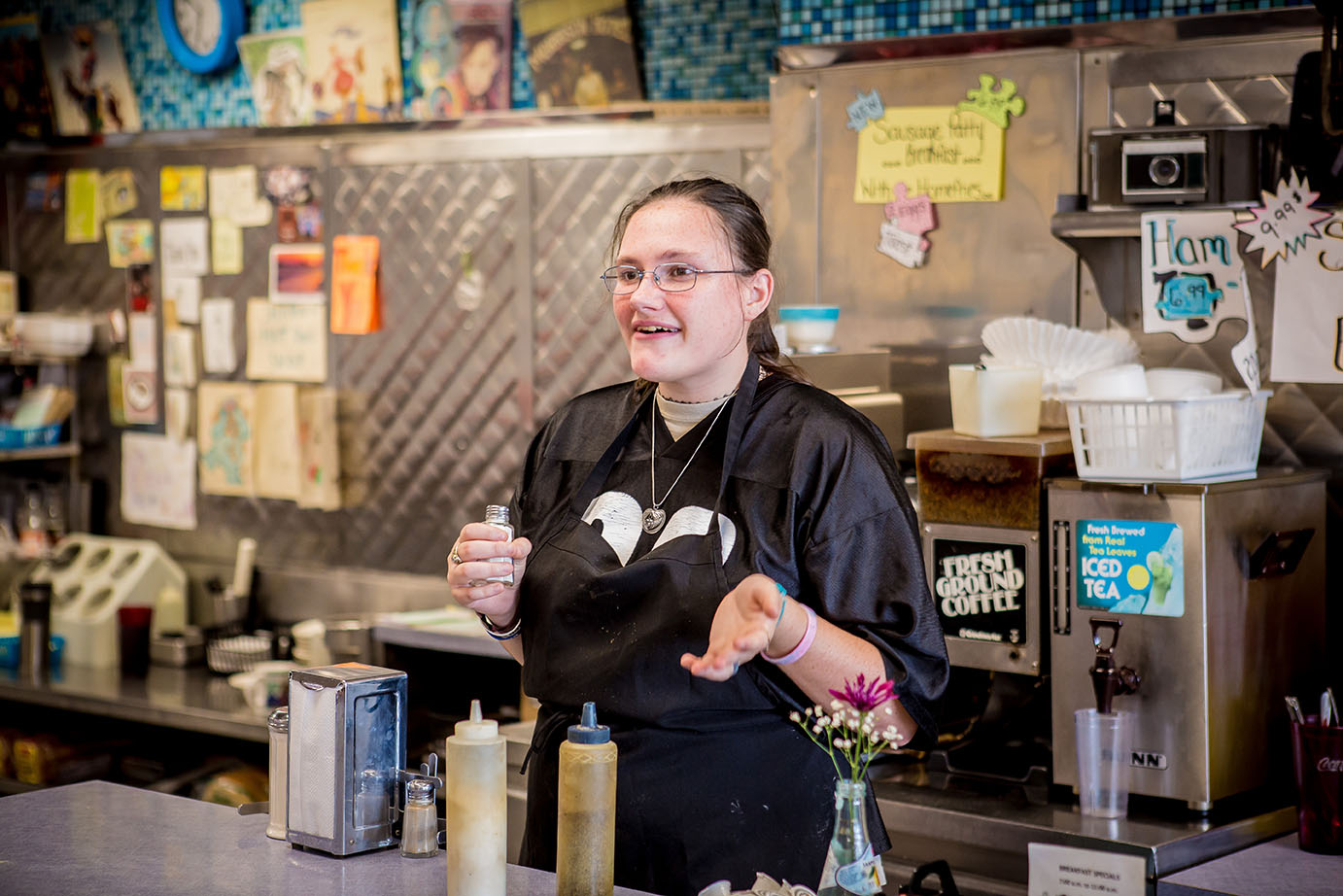 Girl smiling and holding salt shaker