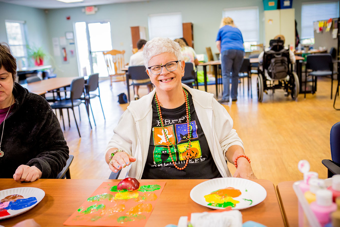 Woman smiling while doing crafts