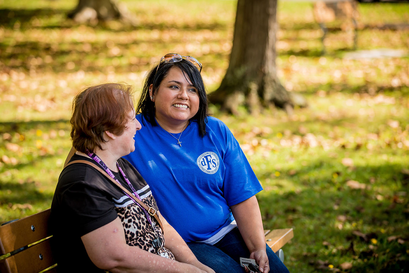 two people sitting in park